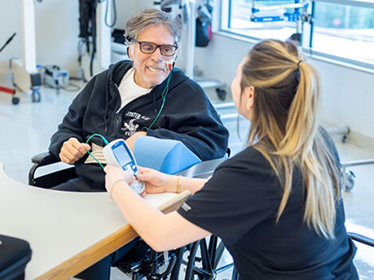 stroke patient working with physical therapist