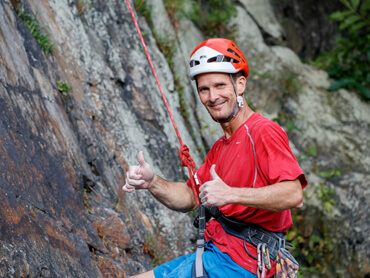 man climbing a mountain