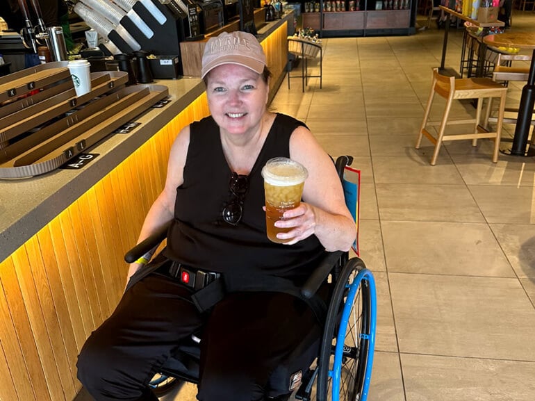 Ann Kallman on a community outing getting coffee while in Kessler Institute for Rehabilitation.