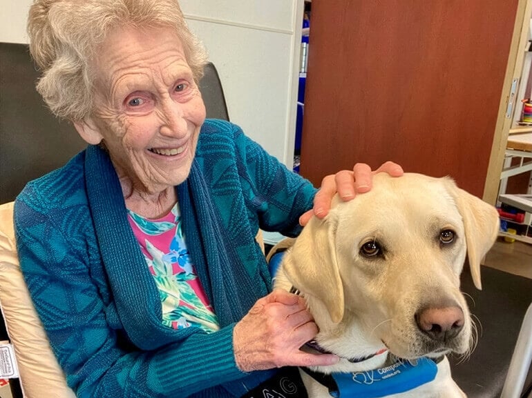 Photo of Shirley Shand with Canine Companion at Kessler Institute for Rehabilitation..