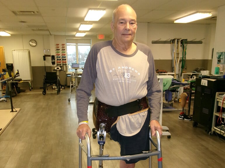 Kenneth Young practices walking with a new prosthetic leg at Kessler Institute for Rehabilitation.