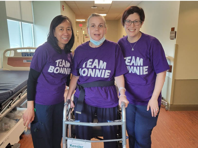Photo of Bonnie Weil with therapists at Kessler Institute for Rehabilitation.