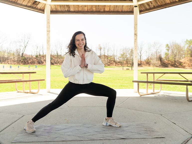 Former Kessler Institute for Rehabilitation stroke patient Sara Shissias does a yoga pose at Connolly Park in New Jersey.